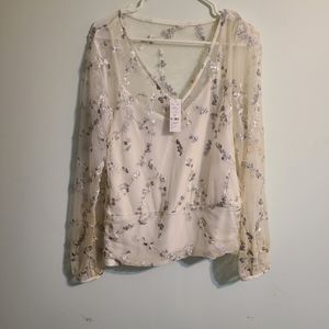 Mesh shirt with embroidery, tank underneath.